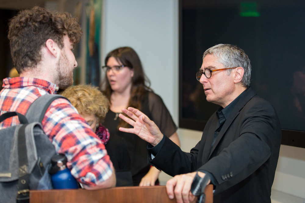 Jeffrey Shandler talks with a student 