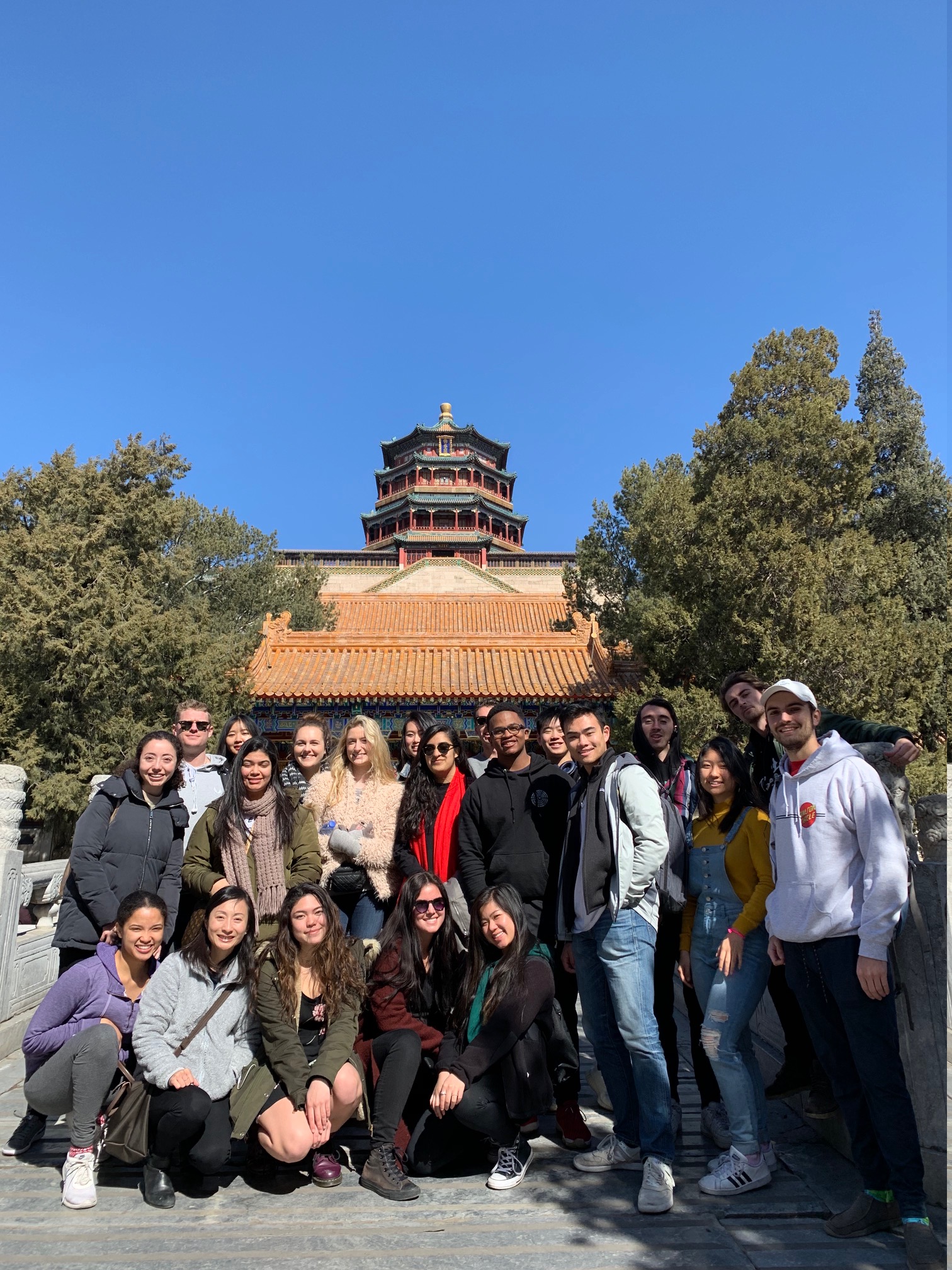 China Immersion students are in front of a tower. 