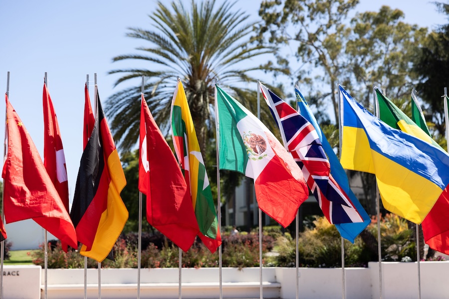 Flags from around the world blue sky