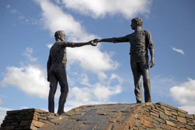 Hands reaching across the divide