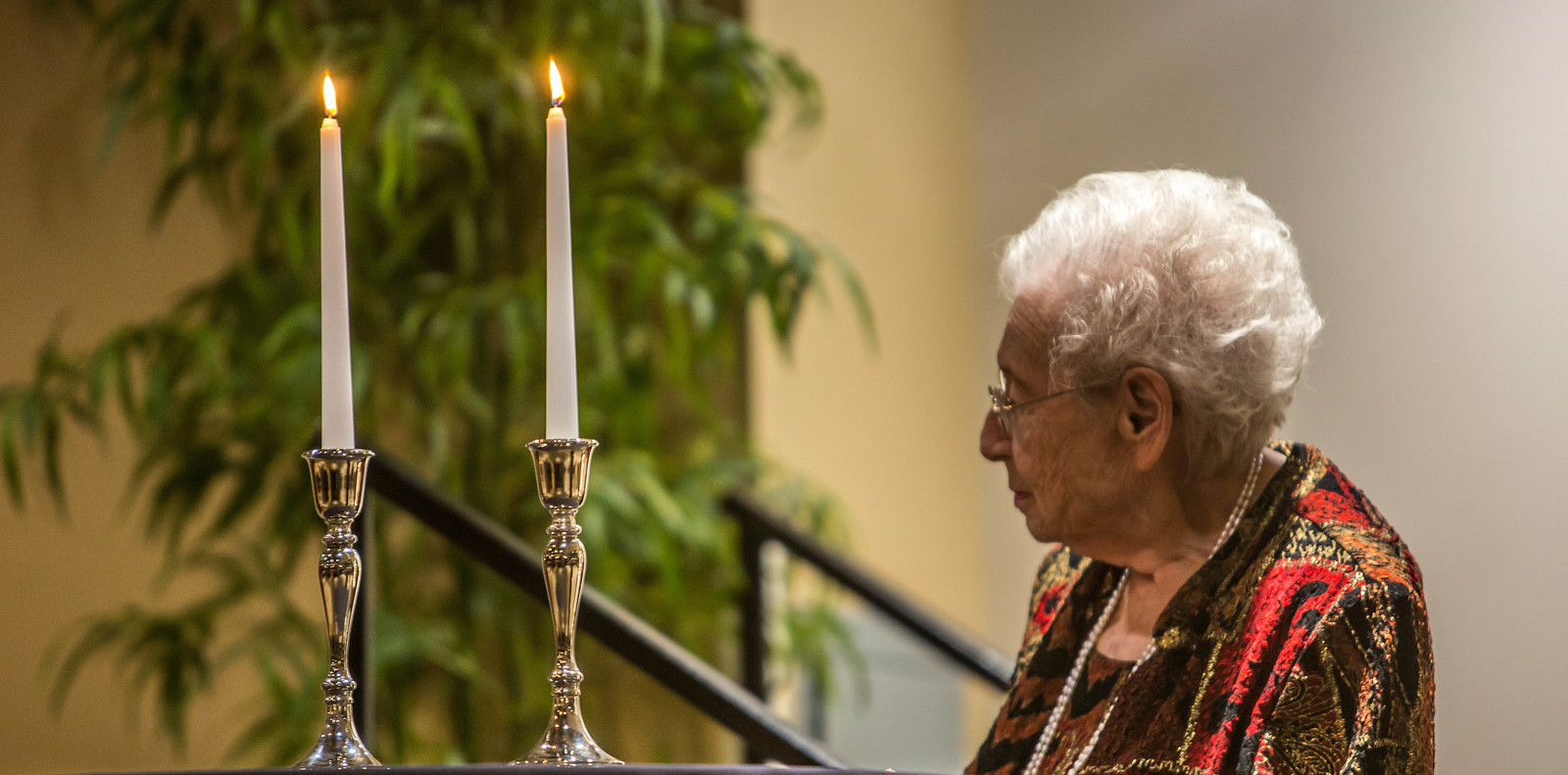 image of 2012 Kristallnacht Holocaust Survivor after lighting candles