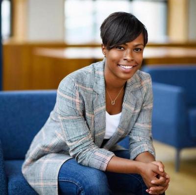 Chaya Crowder sitting on blue chair