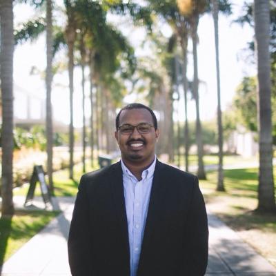 A picture of Senay standing on Palm Walk
