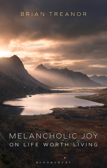 A book cover with an image of the sun shining on a lake through a mountain range, and the title 