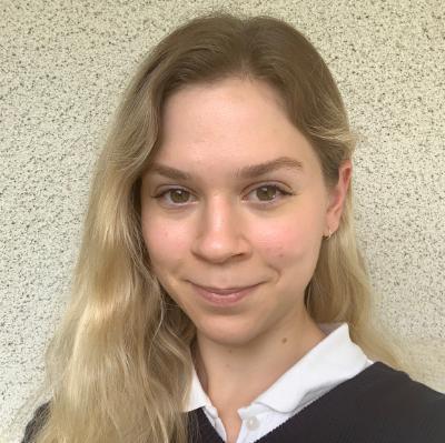 Accalia Rositani headshot cement wall