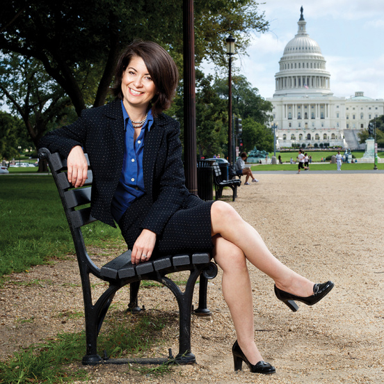 Gabriella Gomez sitting on bench in front of the Capitol 
