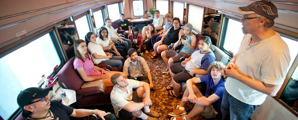 Students and professor on a train