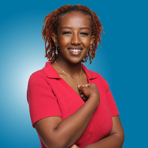 Simret Habte red shirt blue background