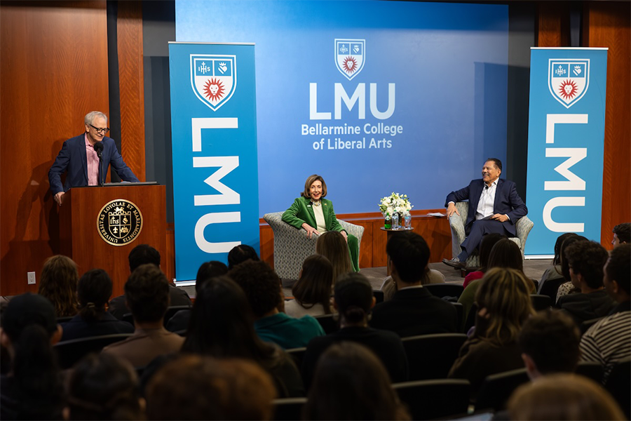Pelosi being introduced by Dean Fox and on stage with Fernando Guerra