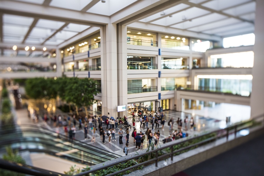 Students mingling in the East Atrium of University Hall