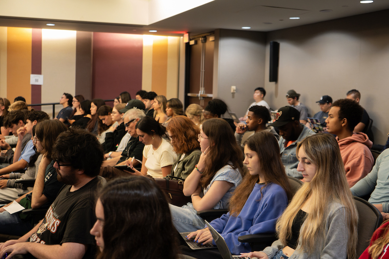 Students sitting in rows listening to Robin brooks