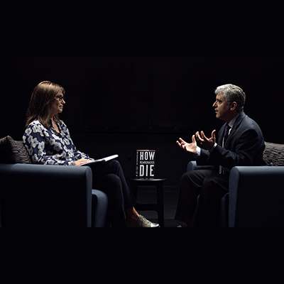 Two People Speaking in Arm Chairs