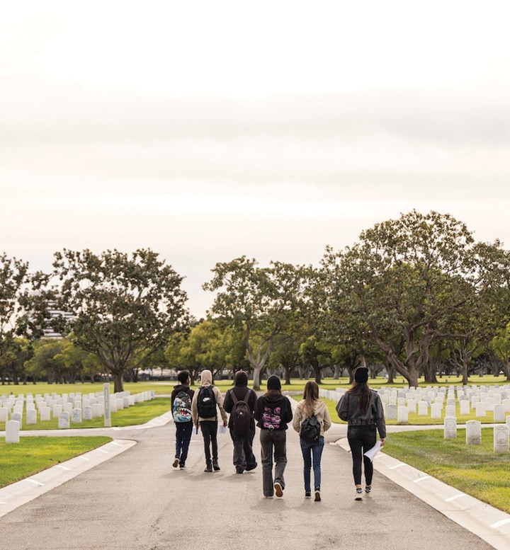 High school students volunteering with LMU’s Digital Veterans Legacy Project recently visited Los Angeles National Cemetery.