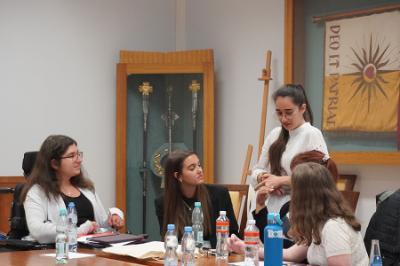 group of students discussing the importance of interfaith connections